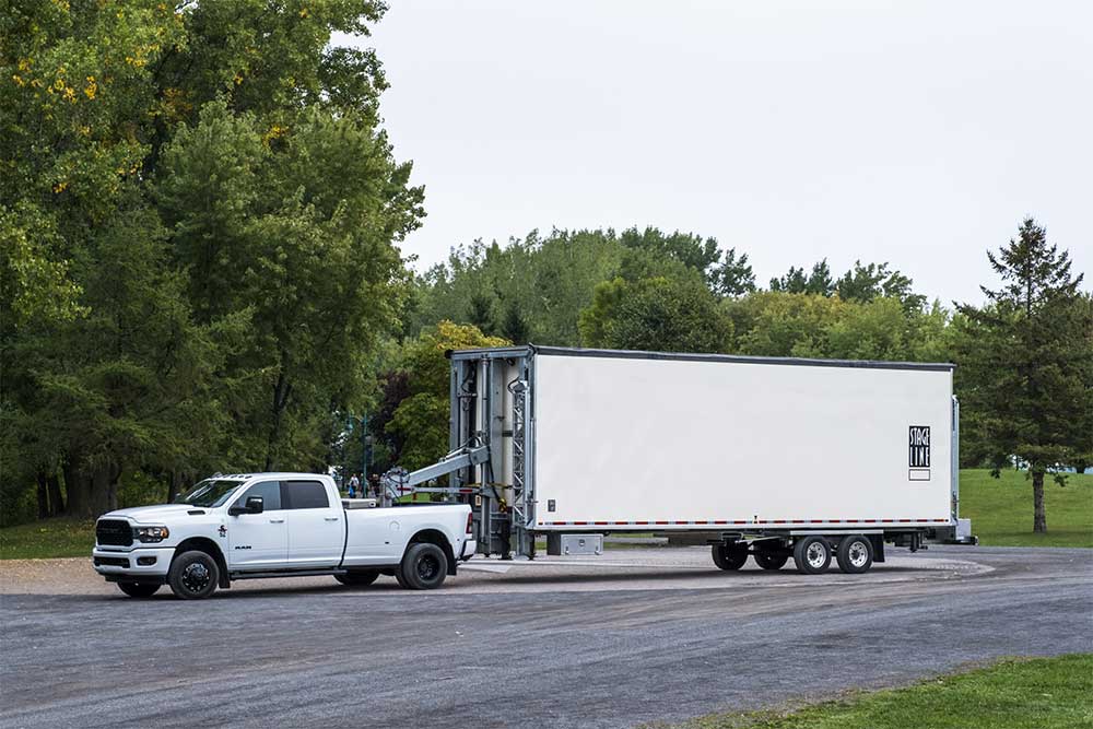 Truck towing the Stageline SL225 mobile stage trailer